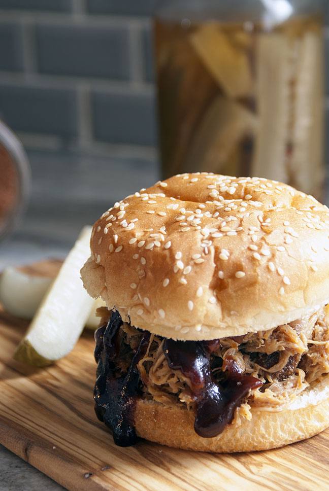 bbq pulled pork sandwiches served with pickle spears
