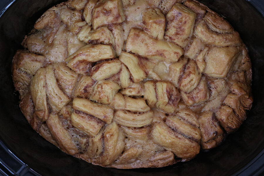 cooked cinnamon rolls in a crockpot