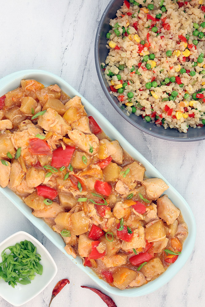 slow cooker pineapple chicken with scallions, dried red chili peppers and cauliflower fried rice